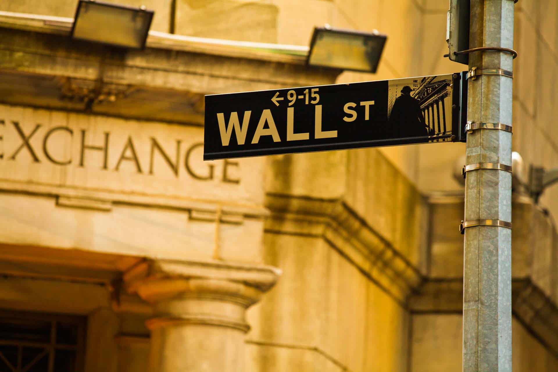 Wall Street sign outside of the New York Stock Exchange building